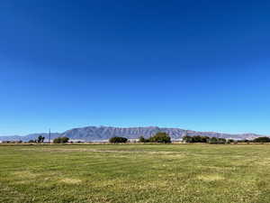 View of mountain backdrop with rural landscape