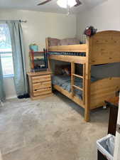 Bedroom featuring ceiling fan and light colored carpet