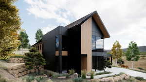 View of home's exterior featuring a standing seam roof, a metal roof, a balcony, and a sunroom