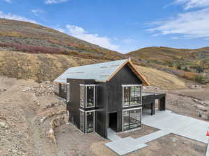 View of outbuilding with a mountain view