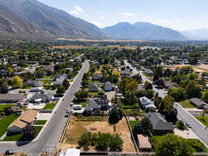 Aerial perspective of suburban area featuring a mountainous background