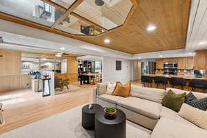 Living area featuring wooden ceiling, recessed lighting, and light wood-style flooring