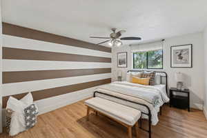 Bedroom featuring light wood-type flooring and a ceiling fan