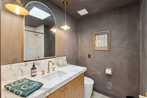 Full bath featuring vanity and a shower