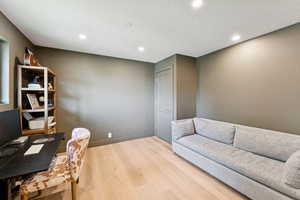 Office featuring recessed lighting, wood finished floors, and a textured ceiling
