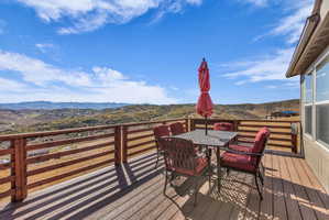 Open outdoor deck featuring a mountain view