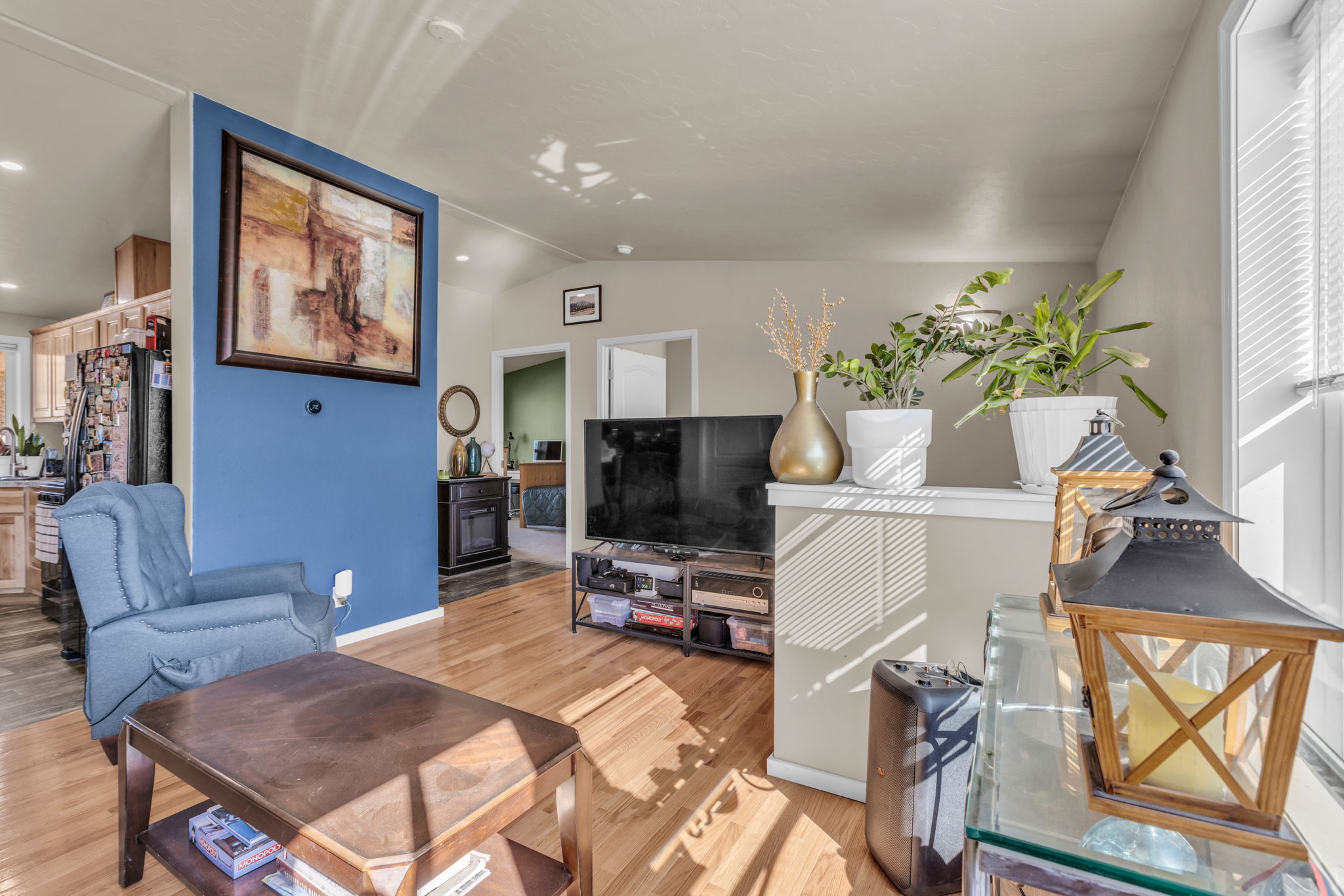 Living room featuring light wood-type flooring, and plenty of natural light