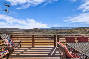 Open outdoor deck featuring a mountain view