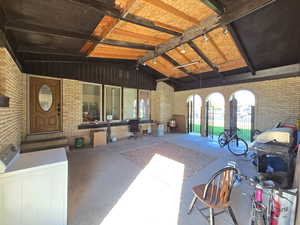 View of patio / terrace featuring washer / dryer and a grill