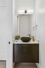 Bathroom featuring vanity and light wood-type flooring