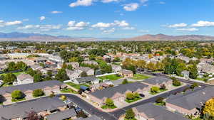 Aerial perspective of suburban area featuring a mountain backdrop