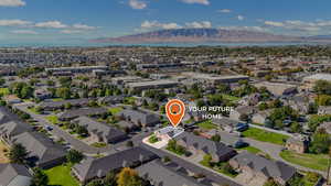 Aerial perspective of suburban area with a mountain backdrop