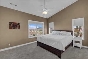 Bedroom featuring carpet flooring, a ceiling fan, and high vaulted ceiling