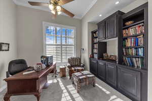 Office with light carpet, ornamental molding, and ceiling fan