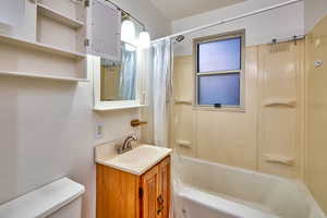 Full bath featuring shower / bath combo and vanity