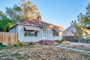 View of front of property featuring a chimney