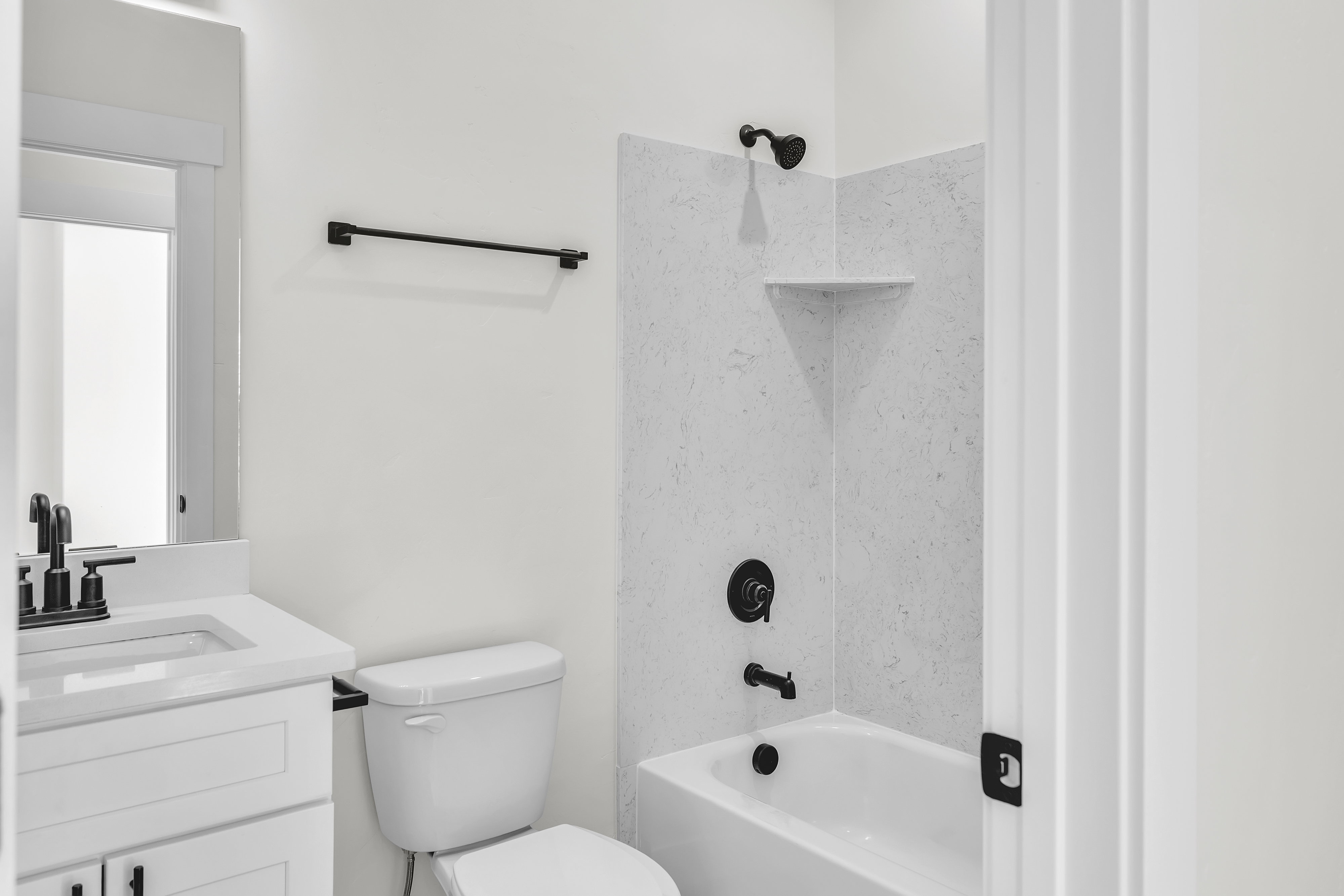Full bath featuring shower / washtub combination and vanity
