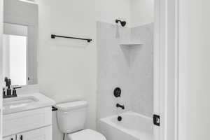 Full bath featuring shower / washtub combination and vanity