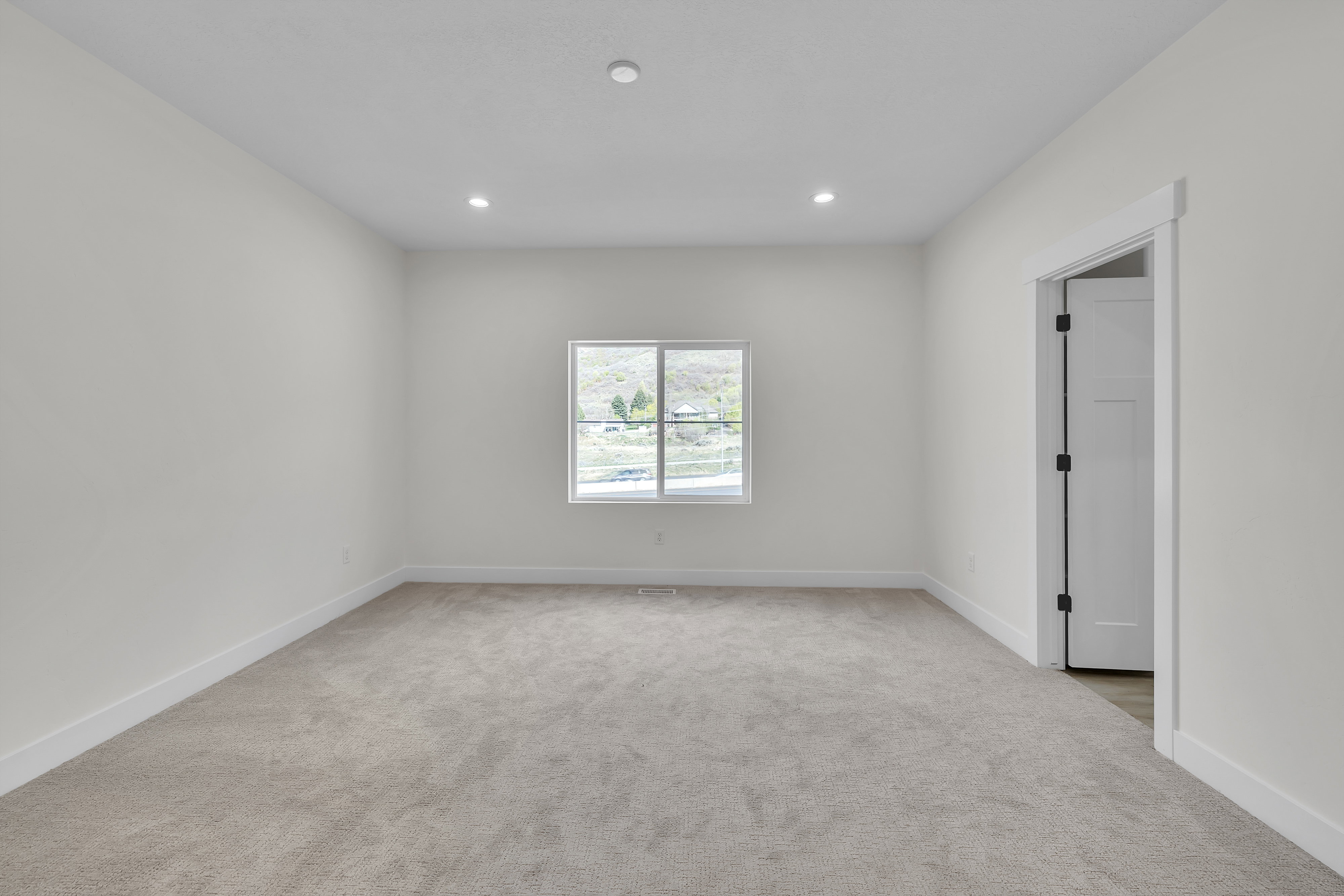 Master Bedroom featuring light carpet and recessed lighting