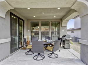 View of patio / terrace with outdoor dining area and a grill