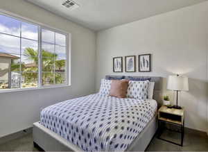 Carpeted bedroom with baseboards