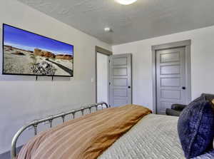 Bedroom with a closet and a textured ceiling