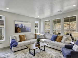 Living room featuring wood tiled floors and recessed lighting