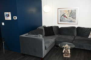 Living room with wood finished floors and baseboards