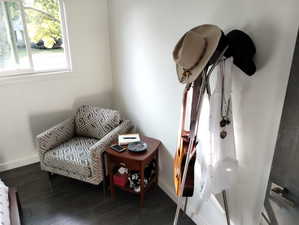 Living area featuring baseboards and wood finished floors