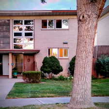 View of front of home featuring brick siding and a front yard