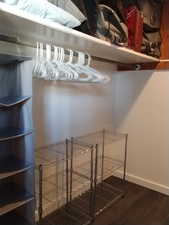 Spacious closet with dark wood finished floors