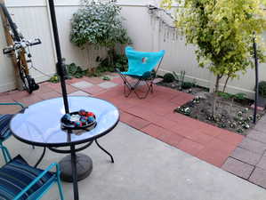 Fenced backyard with a patio