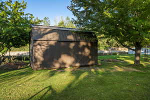 View of outdoor structure with a sunroom