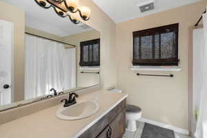 Full bathroom with vanity and light tile patterned floors