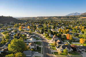 Aerial view of residential area featuring a mountain backdrop