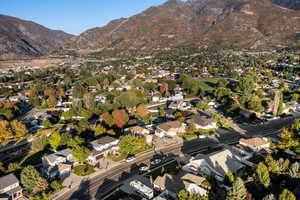 View of property location featuring mountains and nearby suburban area