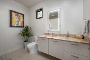 Bathroom with vanity and toilet