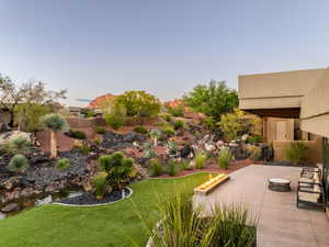 View of yard with a patio area
