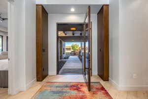 Entrance foyer with baseboards and light wood finished floors