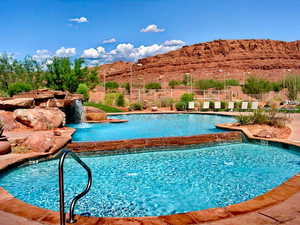 Community pool featuring a mountain view and a patio