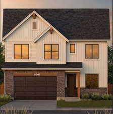 View of front of house with a shingled roof, an attached garage, driveway, and board and batten siding