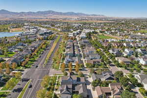 Aerial view of property's location featuring nearby suburban area and a mountain backdrop