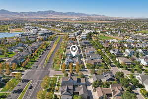 Aerial view of property's location featuring nearby suburban area and a mountainous background