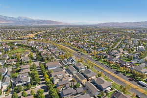 View of property location with mountains and nearby suburban area