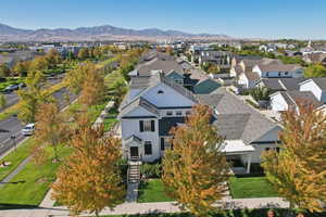 Aerial perspective of suburban area featuring a mountainous background