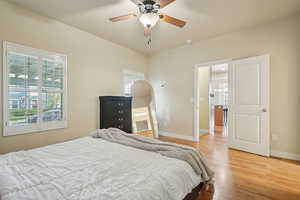 Bedroom featuring light wood-style floors and ceiling fan