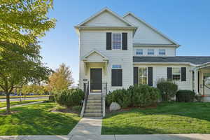 View of front of property with a front lawn