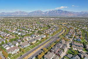 View of property location featuring nearby suburban area and a mountain backdrop