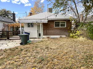 Back of property featuring a patio, a pergola, brick siding, and a chimney