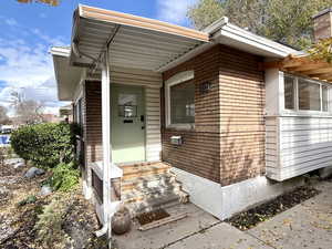 Entrance to property with a porch